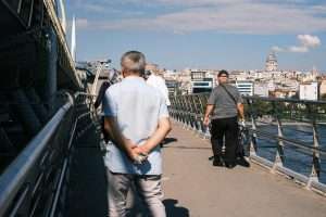 people walking on a bridge in istanbul turkiye