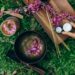 overhead photo of singing bowl and incense sticks