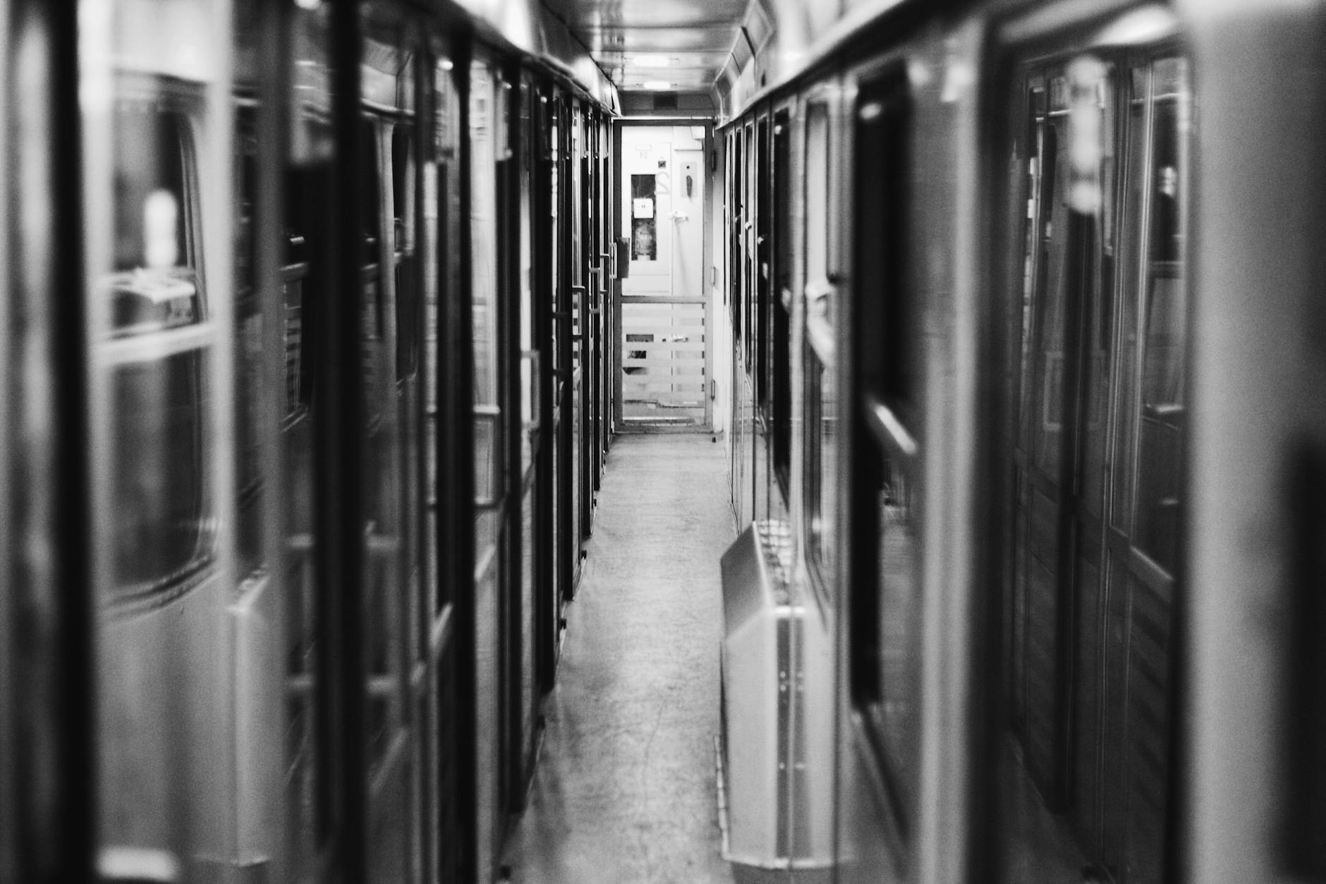 grayscale photo of transit train